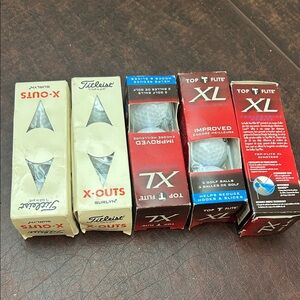 Golf balls. 15 total new in packages